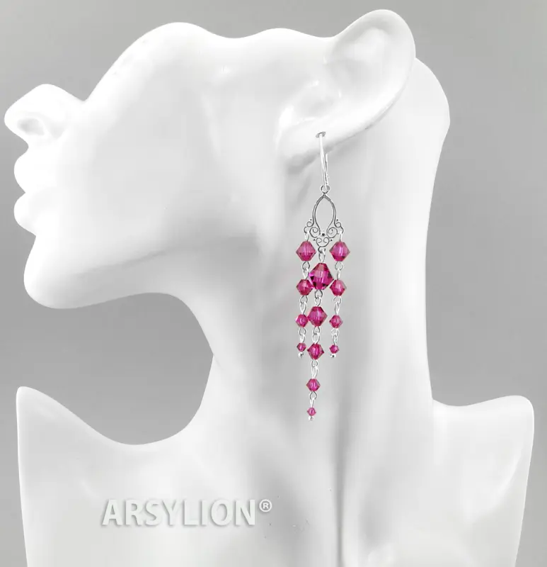 długie, srebrne kolczyki ozdobione kryształkami Swarovski w kolorze fuksji