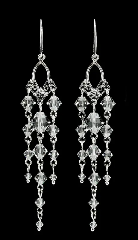 długie srebrne błyszczące kolczyki z oryginalnymi kryształkami crystal